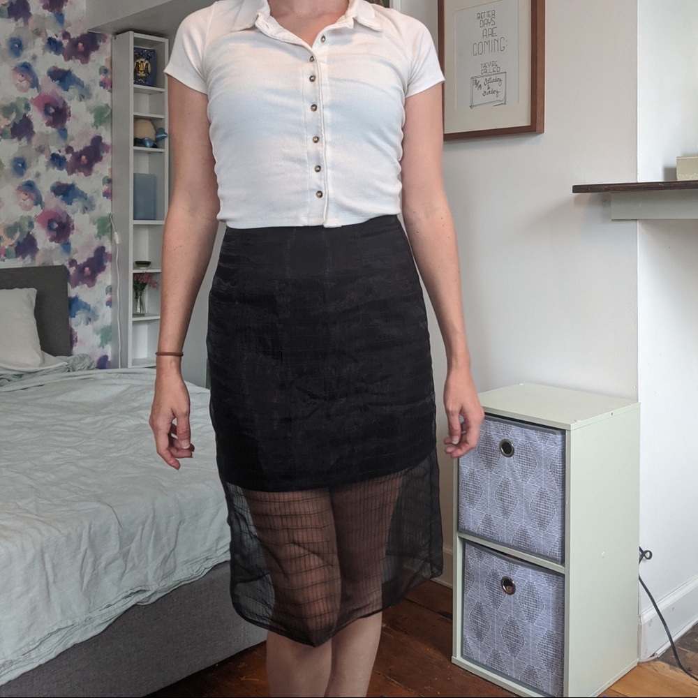 Black pencil skirt with sheer overlay
